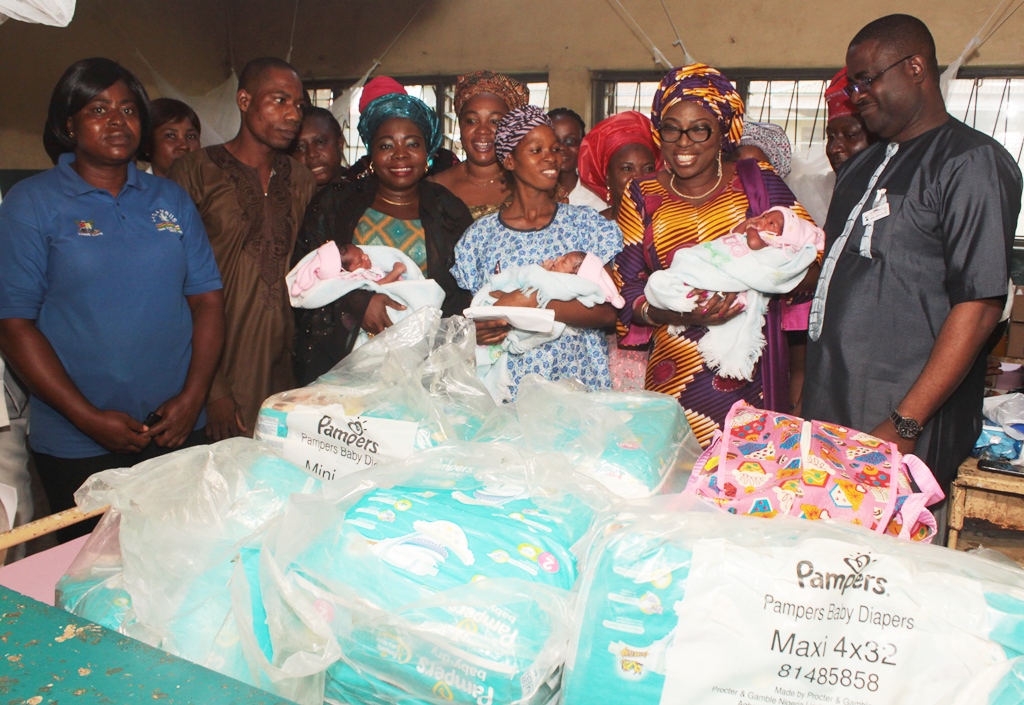 First Lady of Lagos State, Mrs. Bolanle Ambode (2nd right) carrying one of the triplet; Wife of the Speaker, Lagos State House of Assembly, Mrs. Fausat Obasa (2nd left), mother of triplet, Mrs. Abbey Augustine (middle, her husband, Mr. Augustine (left) and the Medical Director, Epe General Hospital, Dr. Mustapha Bamidele (right) during the First Lady’s charity visit to the Hospital at Epe, on Sunday, July 19, 2015.