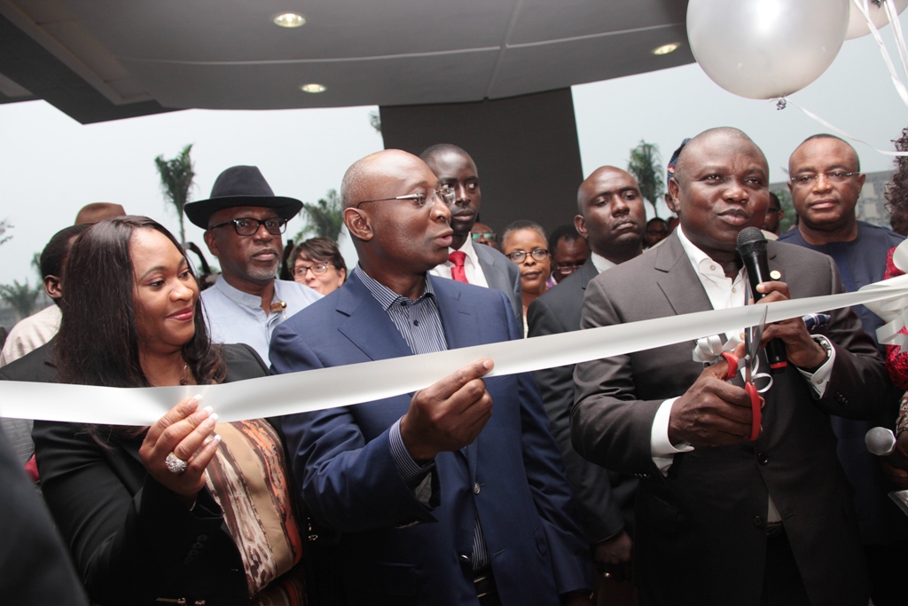 Lagos State Governor, Mr. Akinwunmi Ambode (right) cutting the tape to commission The George Hotel at Ikoyi, the Chairman of the Hotel, Mr. Tien George(middle) with his wife, Dorcas (left) during the event on Friday, July 10, 2015.