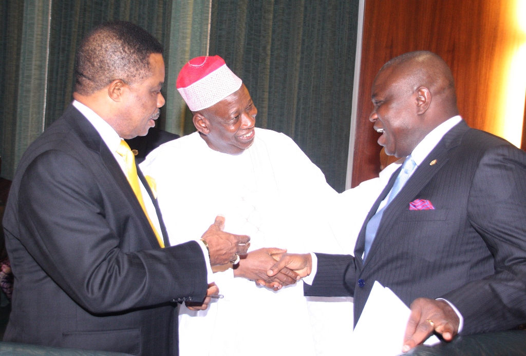Lagos State Governor, Mr. Akinwunmi Ambode (right) in a warm handshake with his Kano State counterpart, Alhaji Abdullahi Ganduje (middle) while Anambra State Governor, Chief Willie Obiano (left) looks on  during the National Economic Council meeting at the State House, Abuja, on Thursday, July 23, 2015.