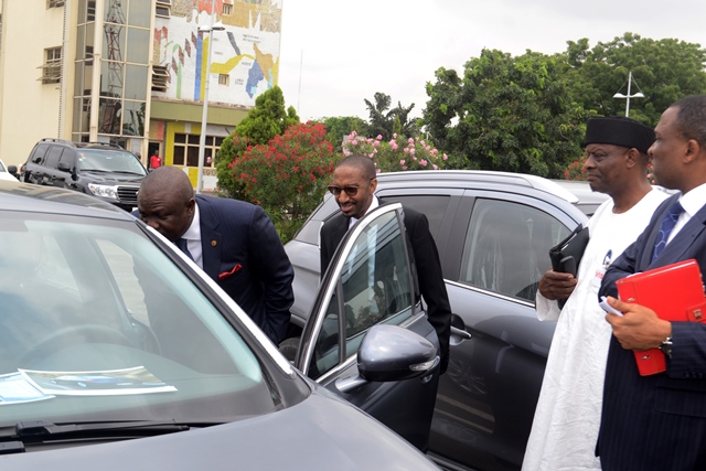 Lagos State Governor, Mr. Akinwunmi Ambode (4th right) looking into a Peugeot car, the Managing Director, Peugeot Automobile Nigeria, Mr. Boyi Ibrahim (3rd right), Executive Director, Finance, Peugeot Automobile Nigeria, Mr. Alli Jumad (2nd right) and Secretary to the State Government, Mr. Tunji Bello (2nd right) during the visit by representatives of Peugeot Automobile Nigeria to the Governor at the Lagos House, Ikeja, on Wednesday, July 22, 2015.