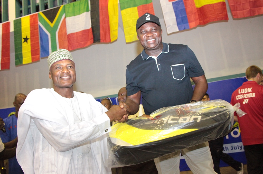 Lagos State Governor, Mr. Akinwunmi Ambode (right), being presented with a  badminton racket by the Director General, National Sports Commission, Alhaji Alhassan Yakmut (right) during the Finals of the 2nd Lagos International Badminton Classics organized by Lagos State Badminton Association at Rowe Park, Yaba, Lagos, on Saturday, July 18, 2015.