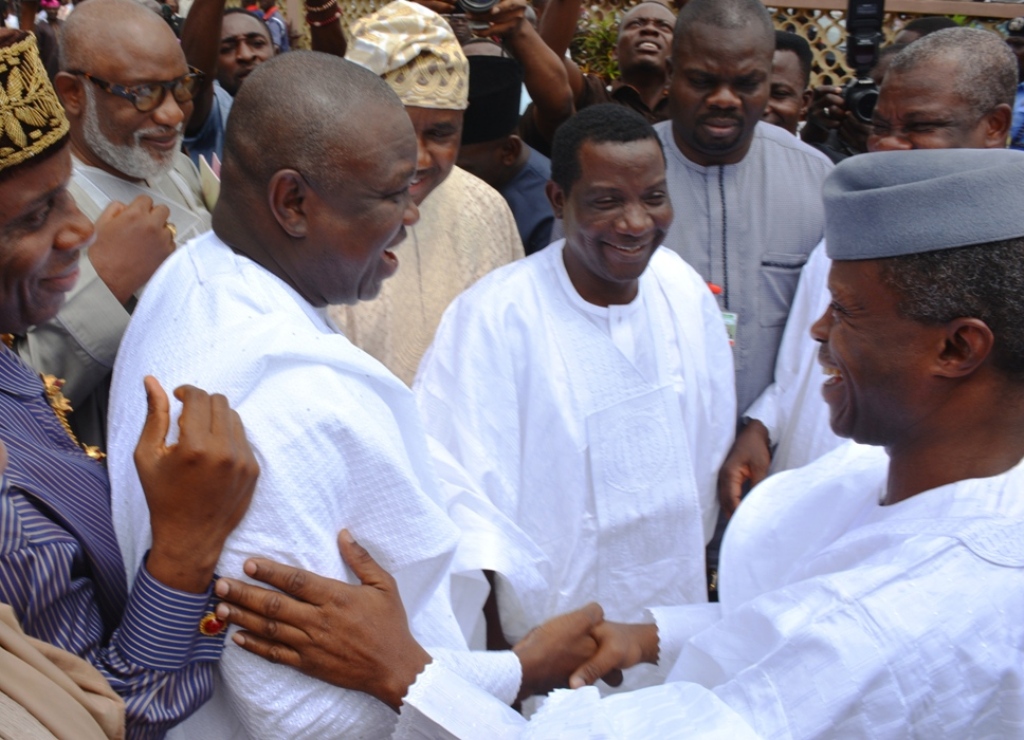 Lagos State Governor, Mr. Akinwunmi Ambode (left) exchanging pleasantries with the Vice President, Prof. Yemo Osibajio (right) while Plateau State Governor, Barrister Simon Lalong (middle) and others watch with admiration during the funeral ceremony of Deaconess Elizabeth Adesola Mamora at the First Ba[tist Church, Isensi, Ijebu-Ife, Ogun State on Saturday, August 08, 2015.