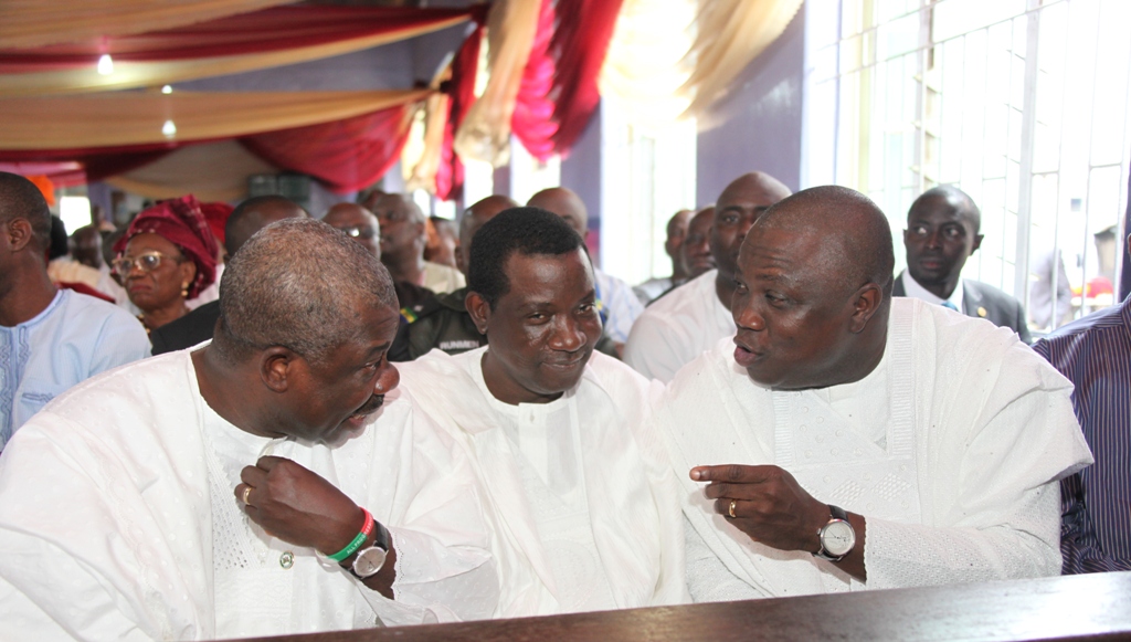 Lagos State Governor, Mr. Akinwunmi Ambode (right) discussing with his Ogun State counterpart, Senator Ibikunle Amosun (left) while Plateau State Governor,  Barrister Simon Lalong (middle) watches during the funeral ceremony of Deaconess Elizabeth Adesola Mamora at the First Ba[tist Church, Isensi, Ijebu-Ife, Ogun State on Saturday, August 08, 2015.