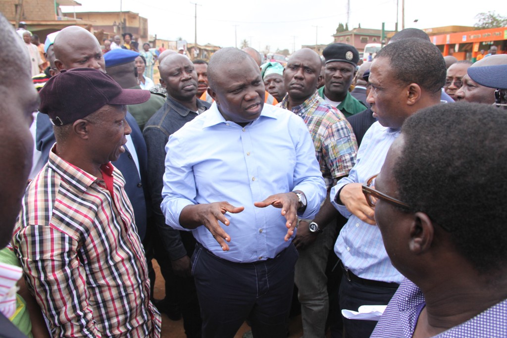 Lagos State Governor, Mr. Akinwunmi Ambode (middle) with the Secretary to the State Government, Mr Tunji Bello (middle) and member, Lagos State House of Assembly, Alimosho Constituency, Hon. Bisi Yusuf (2nd left) during the Governor’s inspection of Ayetoro road, Ipaja-Ayobo, on Wednesday, August 19, 2015.