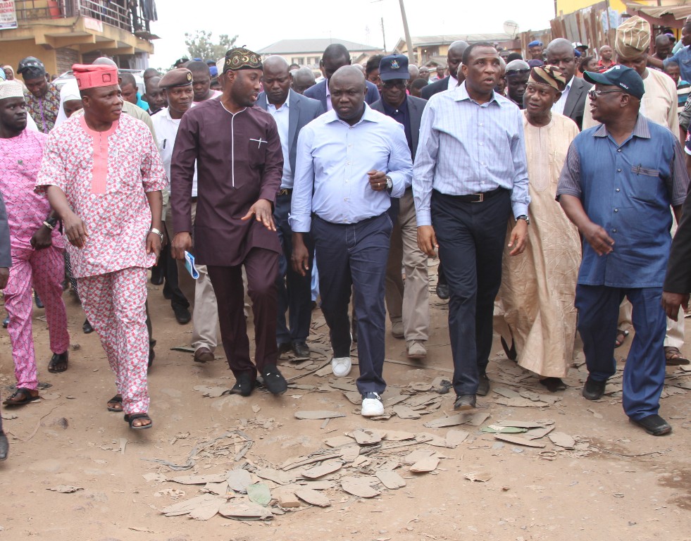 Lagos State Governor, Mr. Akinwunmi Ambode (middle), the Executive Secretary, Oshodi Local Government, Mr. Daud Adeola Olajobi (3rd left), Secretary to the State Government, Mr Tunji Bello (3rd right), former Special Adviser for Ministry of Works & Infrastructure, Engr. Ganbiyu Johnson (right) during the Governor’s inspection of Brown Street for rehabilitation at Oshodi, on Wednesday, August 19, 2015.