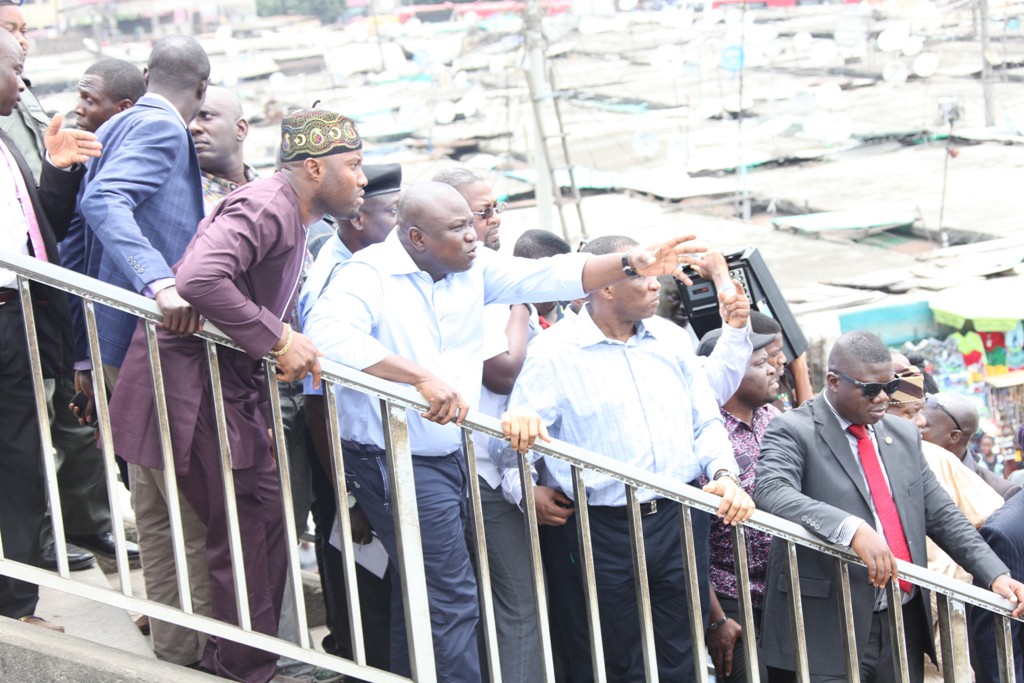 Lagos State Governor, Mr. Akinwunmi Ambode (2nd left), pointing to a place of interest, the Executive Secretary, Oshodi Local Government, Mr. Daud Adeola Olajobi (left)and others during the Governor’s inspection of Brown Street for rehabilitation at Oshodi, on Wednesday, August 19, 2015.