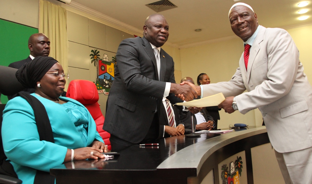 Lagos State Governor, Mr. Akinwunmi Ambode (2nd left) congratulating the Chairman, Governing Board, Lagos State Polytechnic, Ikorodu, Prof. Tajudeen Gbadamosi during the inauguration of the Governing Council of tertiary institutions in the State at the Lagos House, Ikeja, on Tuesday, September 22, 2015. With them are the Deputy Governor, Dr. (Mrs.) Oluranti Adebule.