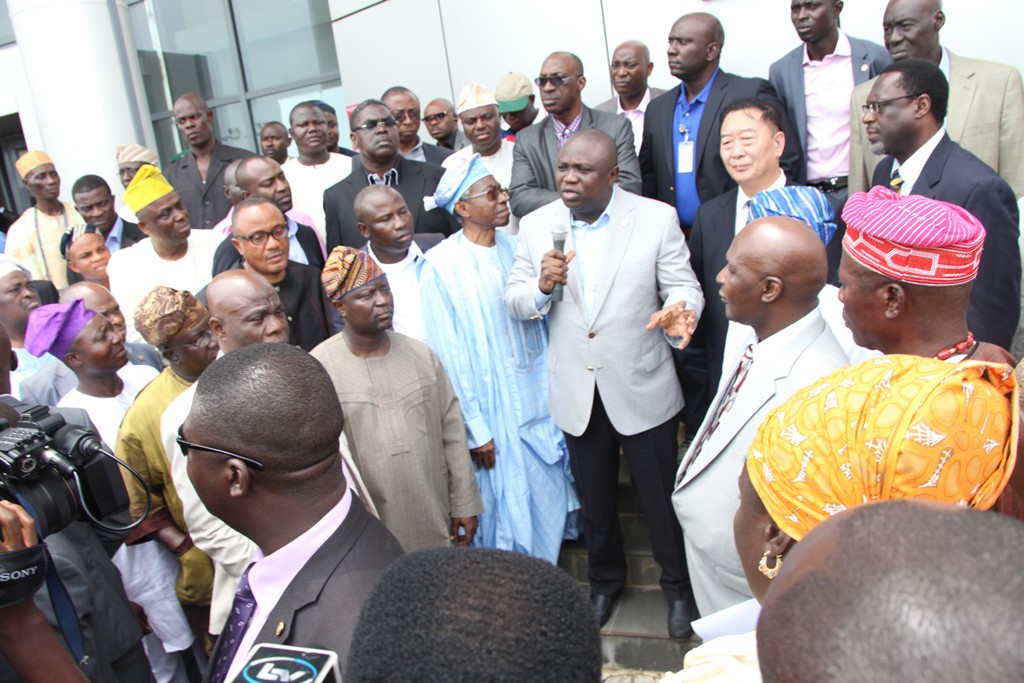 Lagos State Governor, Mr. Akinwunmi Ambode addressing the press shortly after his meeting with the management of Lekki Free Zone Development Company during his inspection visit to the Lekki Free Zone on Wednesday, September 9, 2015. With him are the Chairman, Lekki Free Zone Development Company, Otunba Olusegun Jawando (4th left), the Managing Director, Mr. Ding Yonghua (2nd right), Deputy Managing Director, Mr. Adeyemo Thompson (right) and others.