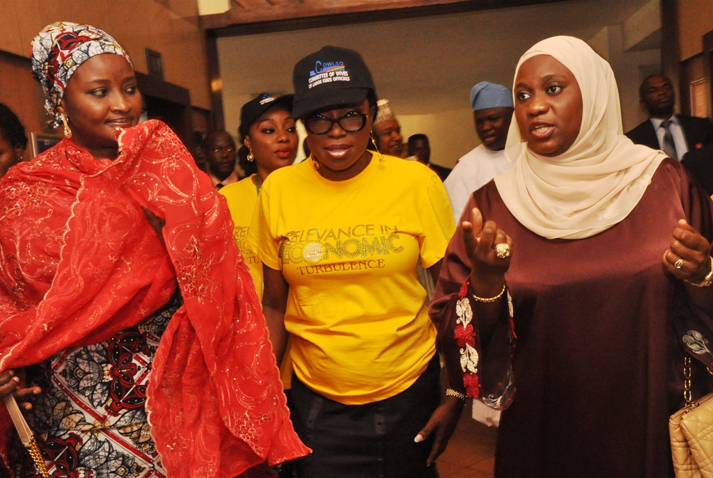 Chairman, Committee of Wives of Lagos State Officials (COWLSO), Mrs. Bolanle Ambode (middle) flanked by Wives of Kebbi & Niger States Governors; Hajia Zainab Bagudu (left) and Hajia Aminat Abubakar Sanni Bello during the opening ceremony of the annual National Women Conference organized by COWLSO, at the Convention Centre, Eko Hotels & Suite on Wednesday, September 16, 2015.