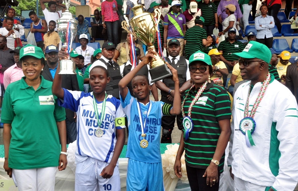 Wife of Lagos State Governor, Mrs. Bolanle Ambode (2nd right), with the Sponsor, Muniru Muse Cup Tournament Senator Oluremi Tinubu (left), the Initiator, Senator Muniru Muse (right), with the Team Captains of Jokers Star Football Club, Yaba (male category) and White Sand Angels (female category) as winners of 2015 Muniru Muse Cup Tournament at the Campus Square Mini Stadium, Lagos Island, on Sunday, September 06, 2015.