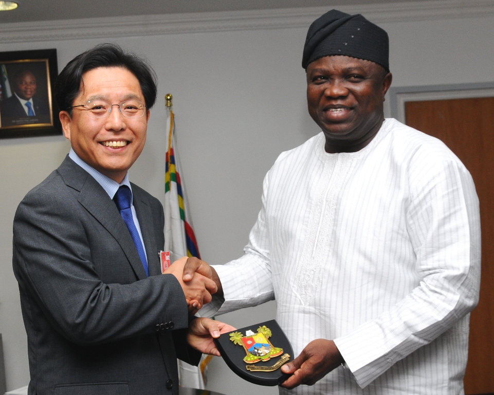 Lagos State Governor, Mr. Akinwunmi Ambode (right) presenting a state plaque to the Ambassador of the Republic of Korea, Mr. Noh Kyu-Duk (left) during a courtesy visit to the Governor in his Office at the Lagos House, Ikeja, on Friday, September 11, 2015. 