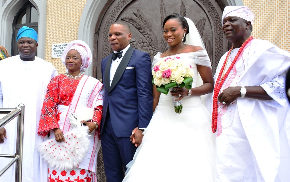 Lagos State Governor, Mr. Akinwunmi Ambode (left), Father of the Bride & former Governor of Osun State, Prince Olagunsoye Oyinlola (right), his wife, Princess Omolara (2nd left)  and the Couple, Oyindamola & Temitope during the wedding ceremony of  Prince Oyinlola’s daughter, at Our Saviours Anglican Church, Tafawa Balewa Square, Lagos Island, on Saturday, September 05, 2015.