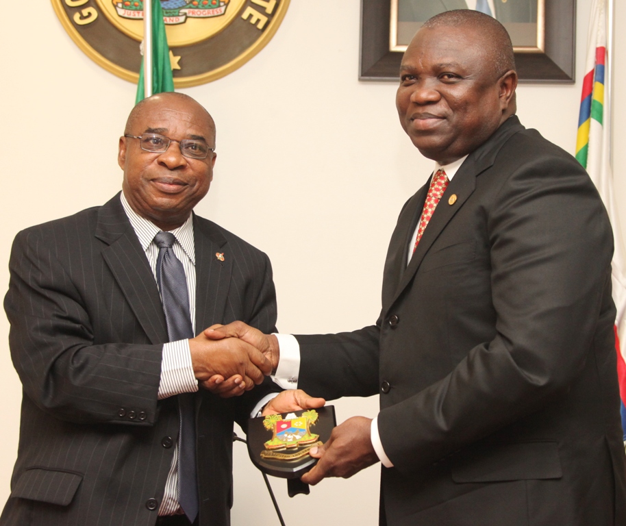 Lagos State Governor, Mr. Akinwunmi Ambode (right) presenting a state plaque to the Coordinator, Hubert Humphrey Fellowship Alumni Association, Nigeria, Mr. Jude Ememe during a courtesy visit to the Governor by members of Hubert Humphrey Fellowship Alumni Association, at the Lagos House, Ikeja, on Friday, September 18, 2015.