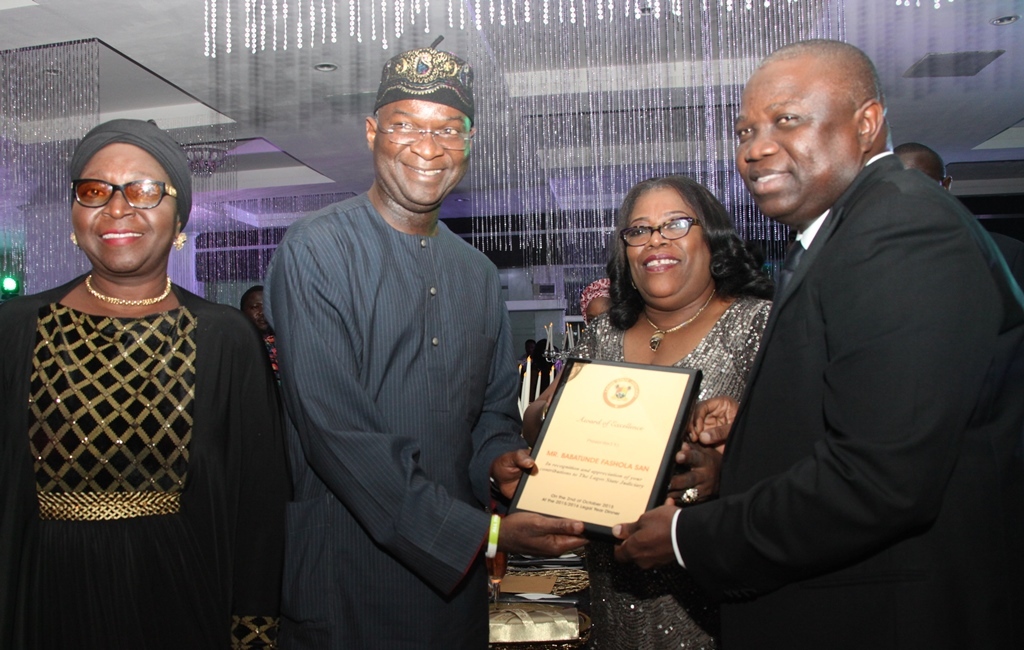 R-L : Lagos State Governor, Mr. Akinwunmi Ambode, with the Chief Judge of Lagos State, Hon. Justice Olufunmilayo Atilade, jointly presenting  an award of Excellence to the former Lagos State Governor, Mr. Babatunde Fashola, SAN,  during the 2015/2016 Legal Year Dinner, at the Law School, Victoria Island, Lagos, on Friday, October 2, 2015. With them is Hon. Justice Toyin Oyekan-Abdullai.