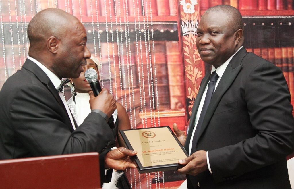 Lagos State Governor, Mr. Akinwunmi Ambode (right), receiving an award of Excellence from Hon. Justice Akeem Olatunde Oshodi, during the 2015/2016 Legal Year Dinner, at the Law School, Victoria Island, Lagos, on Friday, October 2, 2015