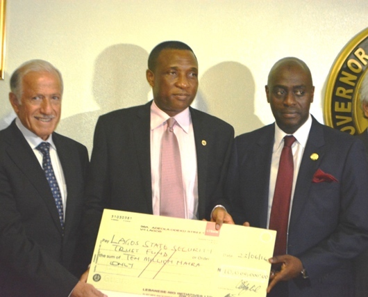 Representative of the Lagos State Governor & Secretary to the State Government, Mr. Tunji Bello (middle), with Executive Secretary, Lagos State Security Trust Fund (LSSTF), Dr. Abdulrazak Balogun (right), jointly receiving a cheque of N10Million donation from the Chairman, Lebanese Nigerian Initiative (LNI), Mr. Faysal El-Khalil (left) during the donation from LNI, at the Lagos House, Ikeja, on Thursday, June 23, 2016.