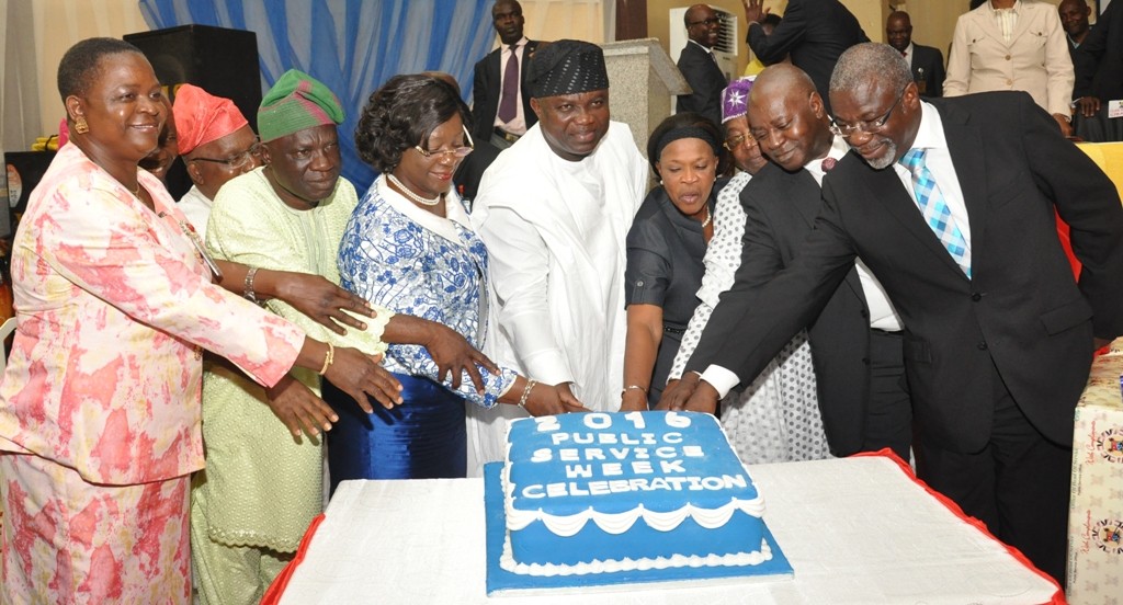  Lagos State Governor, Mr. Akinwunmi Ambode (4th left); Head of Service, Mrs. Olabowale Ademola (3rd left); Commission III, Lagos State Civil Service Commission, Hon. Wasiu Odeyemi (2nd left); Chairman, Lagos State Civil Service Commission, Mrs. Adeyinka Taiwo Oyemade (4th right); former Head of Service, Lagos State,  Mr. Sunny Ajose (3rd right), Guest Speaker, Mr. Olumide Ajomale (left) and other Senior Officers, jointly cutting the cake during the Public Service Day Celebration, at the Adeyemi Bero Auditorium, Alausa, Ikeja, on Thursday, June 23, 2016.