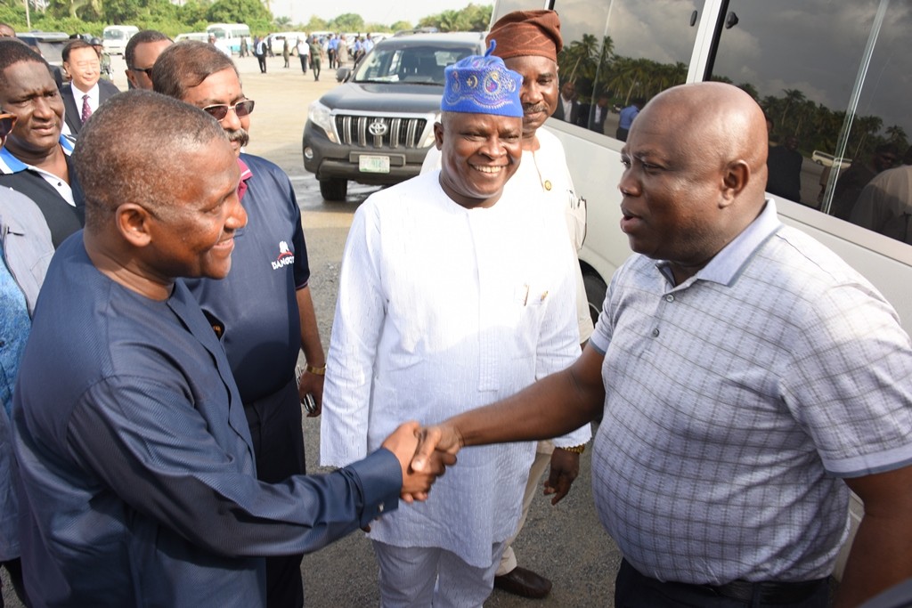 Lagos State Governor, Akinwunmi Ambode (right, exchanging pleasantries with President, Dangote Group; Alhaji Aliko Dangote (left) while Commissioner for Commerce, Industry & Cooperatives, Prince Rotimi Ogunleye (middle), watches with admiration during the Vice President’s inspection visit to the Dangote Projects at the Lekki Free Trade Zone, Lagos, on Saturday, June 25, 2016.