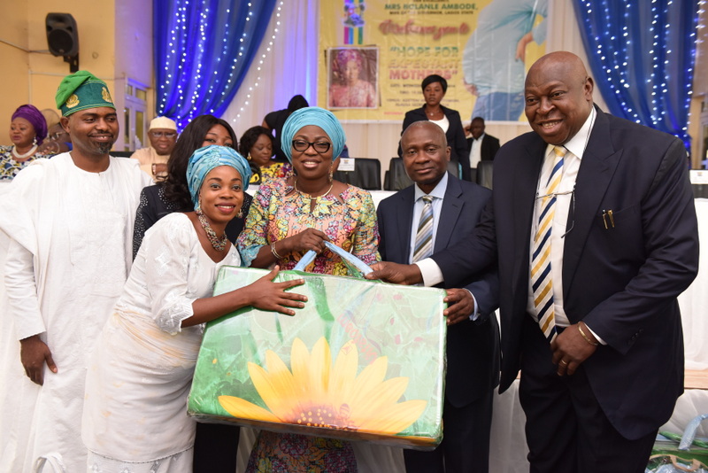 Wife of Lagos State Governor, Mrs. Bolanle Ambode (3rd right); Representative of Hope For Women in Nigeria Initiative, (HOFOWEM), Ms Oyefunke O. Adeleke (2nd right); Commissioner for Health, Dr Jide Idris (2nd right); SA. Primary Healthcare, Dr. Olufemi Onanuga (right); and LAHA Committee Chairman on Health,  Hon Segun Olulade (left) presenting delivery packs to an expectant mother, Mrs. Akinde Taiwo, during the “Hope for Expectant Mothers” support programme, organized by HOFOWEM, at Alausa, on 20th July, 2016.