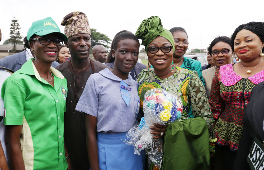 Wife of the Governor of Lagos State, Mrs Bolanle Ambode (M); Director Acct., LASPARK, Mrs. Popoola (L); Sole Administrator, Ikosi Isheri LCDA, Aremo Adewale Abdul (2nd left); Head Girl, Ikosi Snr. Sec. Sch., Miss Omiye Adebola (3rd left); and COWLSO members: Prof. Ibiyemi Tunji-Bello, Mrs Adeola Rotinwa and Mrs Yetunde Braimoh, during the 2016 Tree Planting Exercise at Ikosi Snr. Secondary School, Ketu.