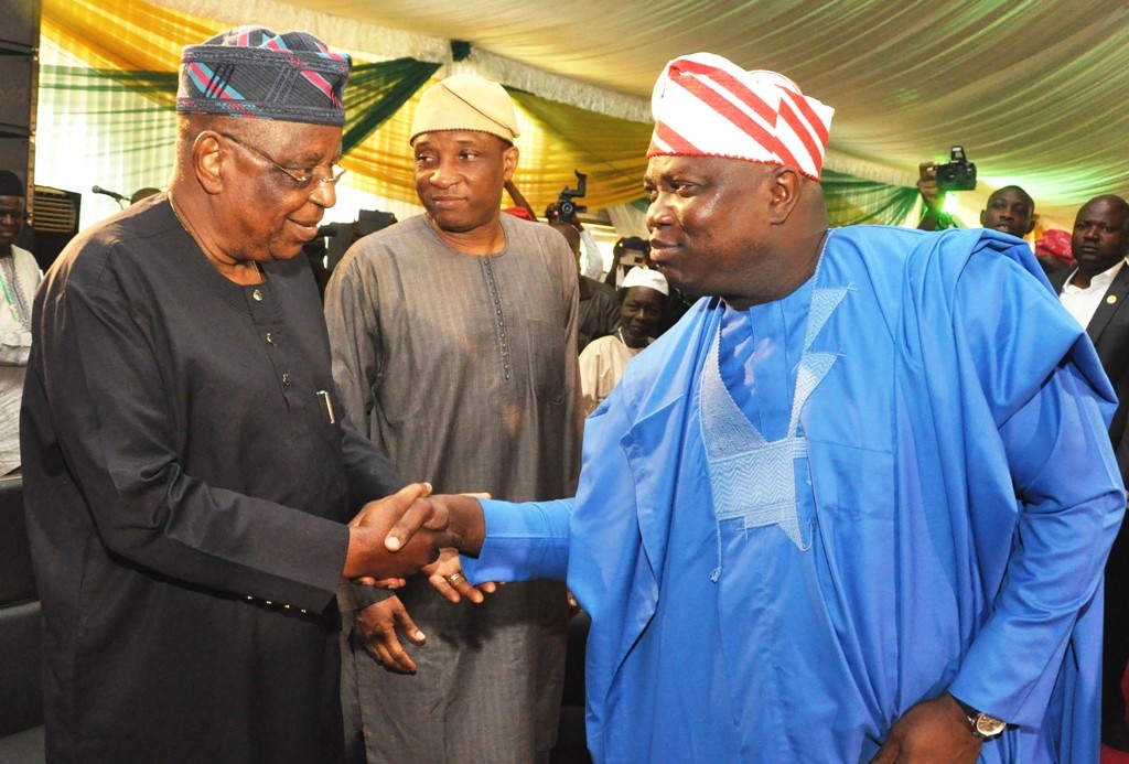 Lagos State Governor, Mr. Akinwunmi Ambode (right), exchanging pleasantries with Chairman, All Progressives Congress (APC), Lagos State Chapter, Otunba Henry Ajomale (left)while the Secretary to the State Government, Mr. Tunji Bello (middle), looks on, during the Y2016 Second Quarter Town Hall meeting at the Muslim Community Playing Ground, General Hospital Road, Badagry, Lagos on Tuesday, July 12, 2016.