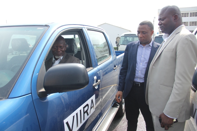 Executive Secretary of the Victoria Island and Ikoyi Security and Environment Trust, (VIISET), Mr. Lateef Muse, test driving one of the two donated vans from the Lagos State Government while Representative of the Lagos State Governor & Secretary to the State Government, Mr. Tunji Bello (2nd right) and Senior Special Assistant to the Governor on Security, Mr. Yinka Akinrinde (right), watch, during the handing over of the Two Hilux Vans to Victoria Island Ikoyi Residents Association, at the Lagos House, Ikeja on Thursday, October 27, 2016.