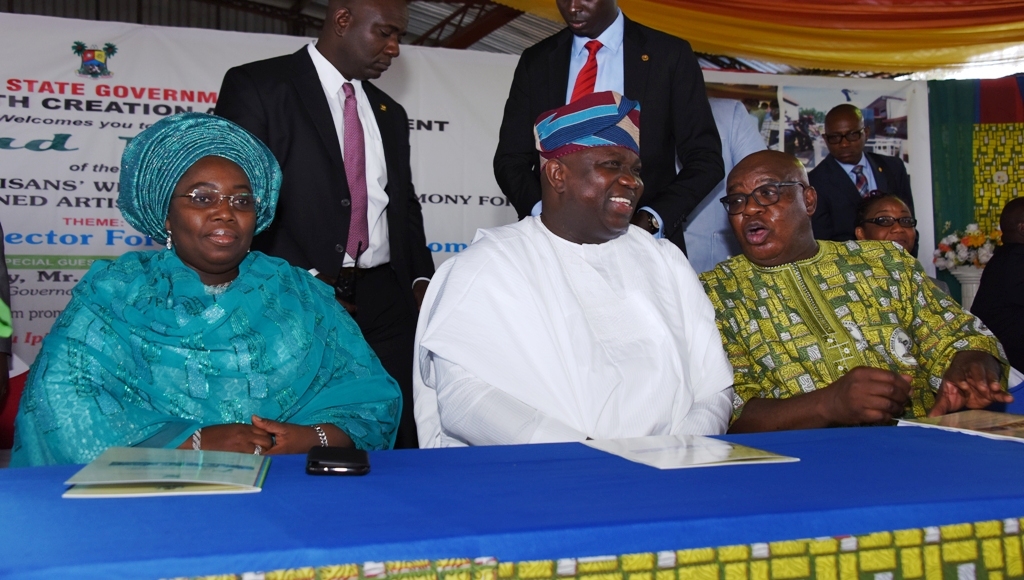 Lagos State Governor, Mr. Akinwunmi Ambode (middle), flanked by Deputy Governor, Dr. (Mrs.) Oluranti Adebule (left) and Commissioner for Wealth Creation & Employment, Dr. Babatunde Durosinmi-Etti (right) during the 7th Tradesmen and Artisans’ Week & Graduation Ceremony for Re-trained Artisans and Traders, at De Blue Roof, Agidingbi, Ikeja, on Tuesday, November 29, 2016.