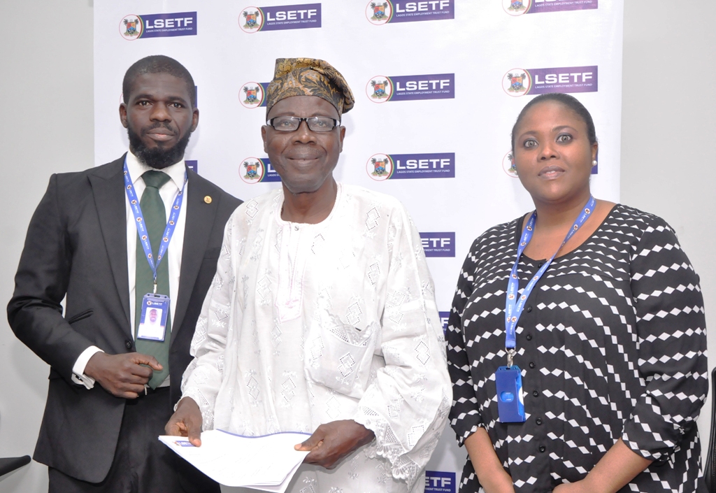 Executive Secretary, Lagos State Employment Trust Fund (LSETF), Mr. Akin Oyebode; Successful Applicant of the Employment Trust Fund, Mr. Ganiyu Ayantunde and Director, Strategy Funding & Stakeholder Engagement, LSETF, Mrs. Abosede Alimi during the distribution of Offer Letters to beneficiaries of the N25 Billion Employment Trust Fund (ETF) Pilot Scheme at the LSETF Office, Oregun, Ikeja, on Friday, December 30, 2016.