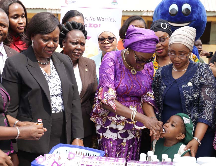 Wife of Lagos State Governor, Mrs. Bolanle Ambode (2nd right), administering de-worming syrup on one of the pupils of Lagos State public primary schools, supported by Commissioner for Youth and Social Development, Pharm. (Mrs) Uzamat Akinbile-Yusuf (right) while the Acting HOS, Mrs. Folashade Adesoye (left); Special Adviser to the Governor on Arts & Culture, Hon. Adebimpe Akinsola (2nd left) and her counterpart for Housing, Mrs. Aramide Giwanson (3rd left), watch during the flag-off of Mass Deworming programme for pupils in Public Primary Schools, organized by  the Ministry of Youth and Social Development, at Maryland, Lagos, on Monday, 23 January, 2017.