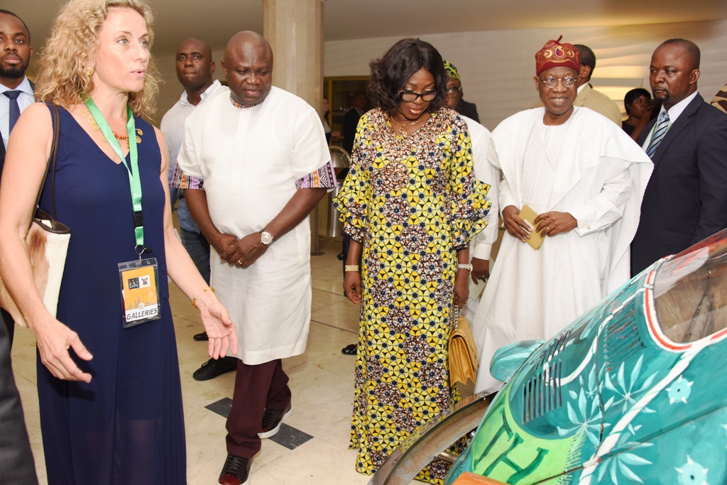 Lagos State Governor, Mr. Akinwunmi Ambode (2nd left); his wife, Bolanle (2nd right); Minister of Information & Culture, Alhaji Lai Mohammed (right), with an artistic designed car by Visual Artist, Polly Alakija (left) during the Opening of the Rasheed Gbadamosi Art Exhibition as part of activities to celebrate Lagos@50 at the Eko Hotel & Suites, Victoria Island, Lagos, on Friday, January 27, 2017.