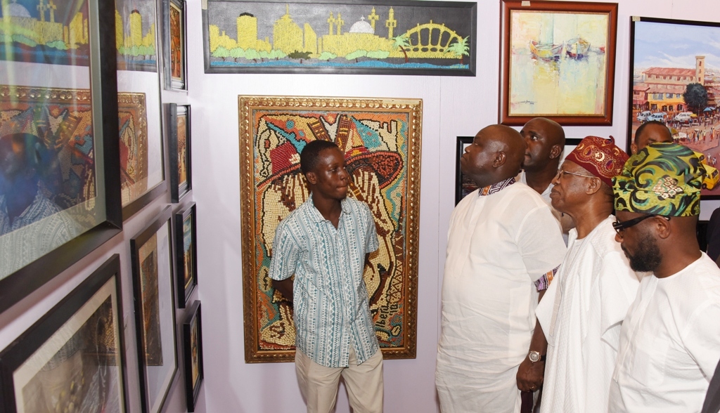 Lagos State Governor, Mr. Akinwunmi Ambode (2nd left); Minister of Information & Culture, Alhaji Lai Mohammed (2nd right); member,House of Representatives, Hon. Babajimi Benson (left) with Hebeeb Audu Artwoks (left) during the Opening of the Rasheed Gbadamosi Art Exhibition as part of activities to celebrate Lagos@50 at the Eko Hotel & Suites, Victoria Island, Lagos, on Friday, January 27, 2017.