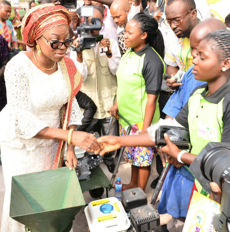 Wife of Lagos State Governor, Mrs. Bolanle Ambode presenting a brand new grinding machine to one of the beneficiaries, Mrs. Adaku Agu during the Women Empowerment programme at the on-going quarterly meeting of the Southern Governors' Wives' Forum (SGWF) in Umuahia, Abia State, on Thursday, 16 February, 2017.