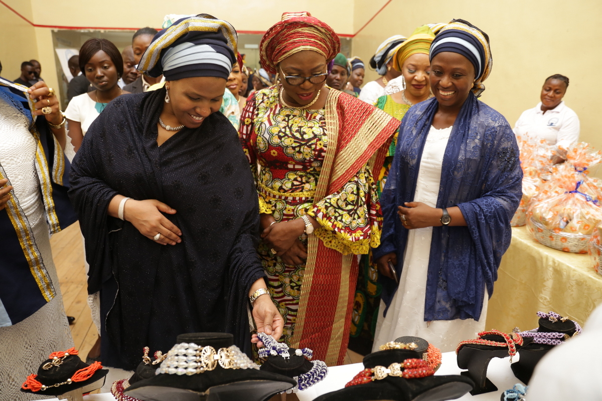 Wife of Lagos State Governor, Mrs. Bolanle Ambode (middle), with the National President of Nigerian Air Force Officers Wives Association (NAFOWA), Hajiya Hafsat Abubakar (left) and Mrs. Larai Gbum (right), inspecting exhibition stands, during the graduation and closing ceremony of NAFOWA Skills Acquisition and Vocational Training program for the youths and women, at the Sam Ethnan Air Force Base, Ikeja, on Thursday, 27 April, 2017.