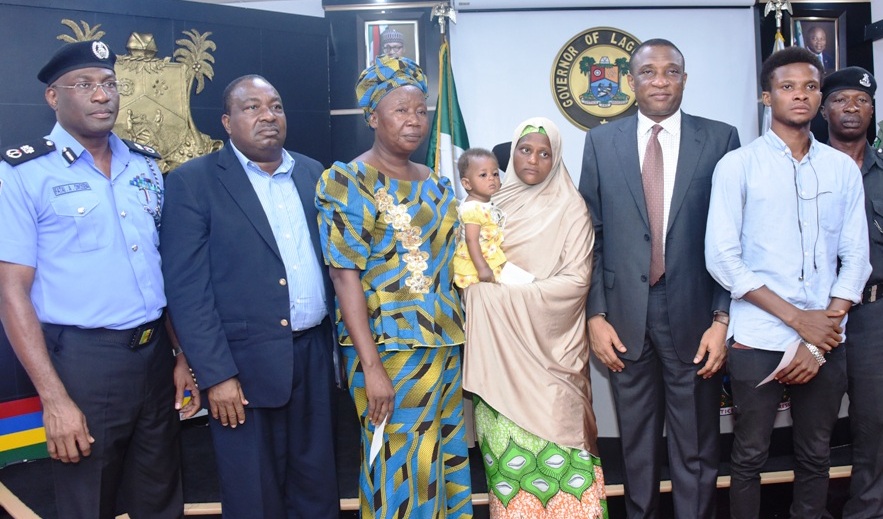 Commissioner of Police, Mr. Fatai Owoseni; Chairman, Lagos State Neigbourhood Safety Corps, Rtd. D.I.G Israel Ajao; widows of killed Policemen, Mrs. Temilade Godwin; Mariam Mamuda; Secretary to the State Government, Mr. Tunji Bello; Son of killed Policeman, Mr. Francis Emmanuel; CSP. Ejiofor Obiora during the presentation of cheques to the Families of the Killed Policemen by Governor Akinwunmi Ambode at the Lagos House, Ikeja, on Monday, May 15, 2017.