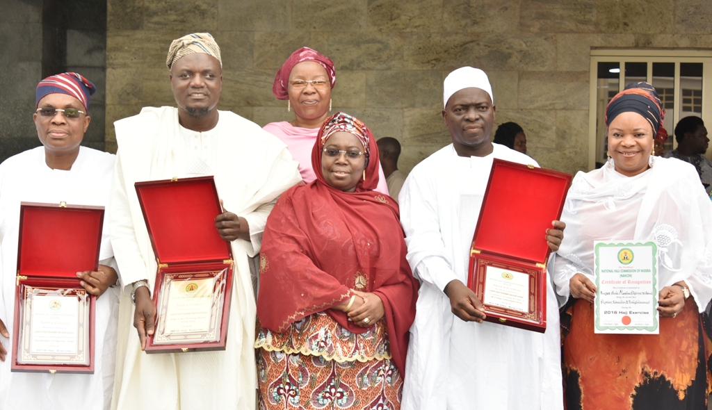 Representative of Lagos State Governor & Deputy Governor, Dr. (Mrs) Oluranti Adebule (middle); South West Commissioner, National Hajj Commission of Nigeria, Imam Fauad Adeyemi (2nd right); Special Adviser to the Governor on Housing, Mrs. Aramide Giwanson (right); Commissioner for Home Affairs, Dr. Abdul-Lateef Abdul-Hakeem (2nd left); CEO, Medview Airline Plc., Mr. Muneer Bankole (left) and Managing Director, Africana Home Restaurant Dubai, Mrs. Khadijat Ebon Bakare (behind) during the awards presentation to the Lagos State Government by the Hajj Commission at the Lagos House, Ikeja, on Friday, July 7, 2017.