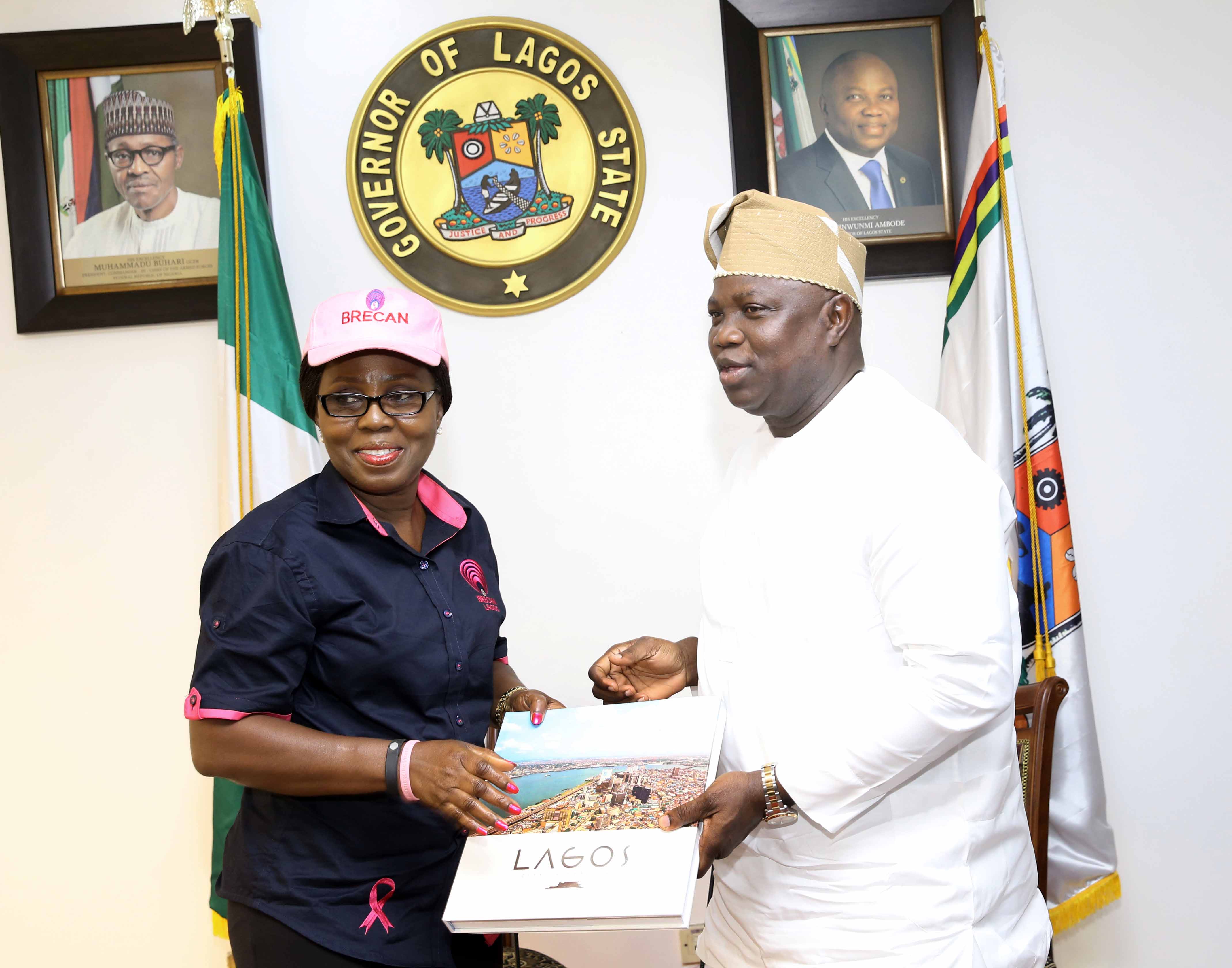  Lagos State Governor, Mr. Akinwunmi Ambode (right), presents a souvenir to the First Lady Of Ondo State, Mrs. Betty Anyanwu-Akeredolu during a courtesy visit by the First Lady and members of Breast Cancer Association of Nigeria (BRECAN), at the Lagos House, Ikeja, on Thursday, September 21, 2017.