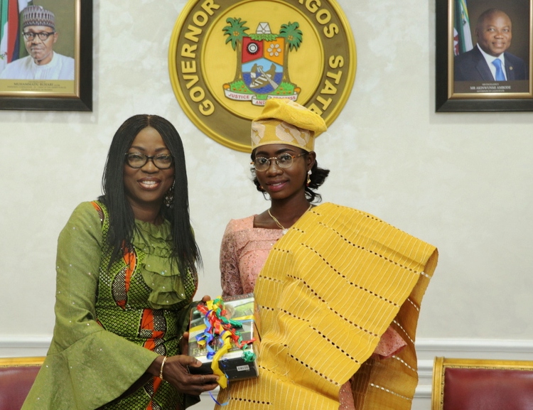 Wife of Lagos State Governor, Mrs. Bolanle Ambode (left), presenting a gift to winner of the 2017 Spelling Bee Competition & One-Day Governor, Miss Zuffon Bukola from Awodi Ora Senior Secondary School (right) during the 2017 One-Day Governor’s visit to the wife of the Governor, at Lagos House, Ikeja, on Wednesday, September 13, 2017. 