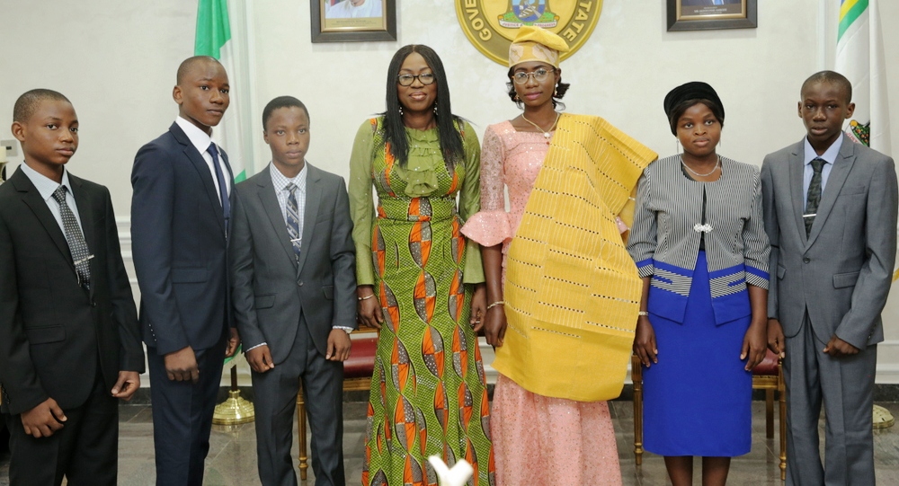 Wife of the Governor of Lagos State, Mrs. Bolanle Ambode (middle); winner of the 2017 Spelling Bee Competition & One-Day Governor, Miss Zuffon Bukola from Awodi Ora Senior Secondary School (3rd right); One-Day Deputy Governor, Miss Rosemary Ogidan (2nd right) and the Cabinet members during their visit to the wife of the Governor, at Lagos House, Ikeja, on Wednesday, September 13, 2017.