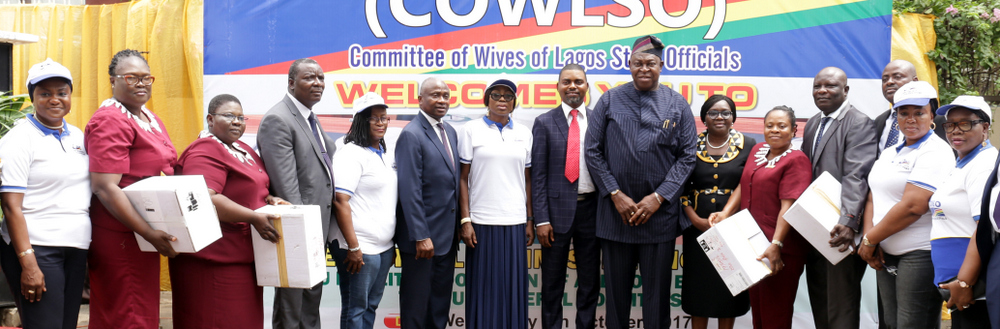 Wife of Lagos State Governor & Chairman, Committee of Wives of Lagos State Officials (COWLSO), Mrs. Bolanle Ambode (7th left); Commissioner for Health, Dr. Jide Idris (6th left); Special Adviser to the Governor on Primary Health Care, Dr. Olufemi Onanuga (7th right); Chairman, Lagos State House of Assembly Committee on Health, Hon. Segun Olulade (middle), with COWLSO project team and beneficiary General Hospitals of the  donated auditory equipment boxes during the commissioning of Intensive Care Unit facilities & donation of auditory equipment for General Hospitals by COWLSO, at the Lagos Island Maternity Hospital, on Wednesday, 4 October, 2017.