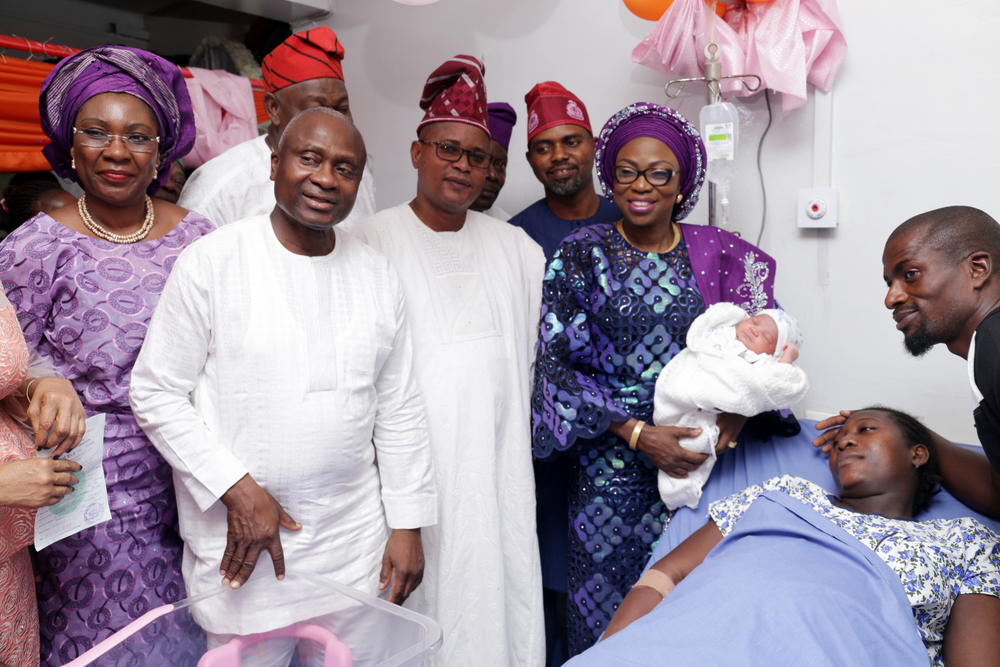 Wife of the Governor of Lagos State, Mrs. Bolanle Ambode with first baby of the year (3rd right); Dep. Speaker, Lagos State House of assembly, Hon. Wasiu Eshilokun (3rd left); HC Health, Dr. Jide Idris (2nd left); Hon Segun Olulade (m); member of COWLSO, Prof. Ibiyemi Olatunji-Bello (L); and parent of the first baby of the year, Mr. & Mrs. Lateef Ikudaisi (r), during the presentation of gifts to the first baby of the year, born 12:05am, weigh 2.9kg, at the Lagos Island Maternity Hospital, on Monday, 1st January, 2018.