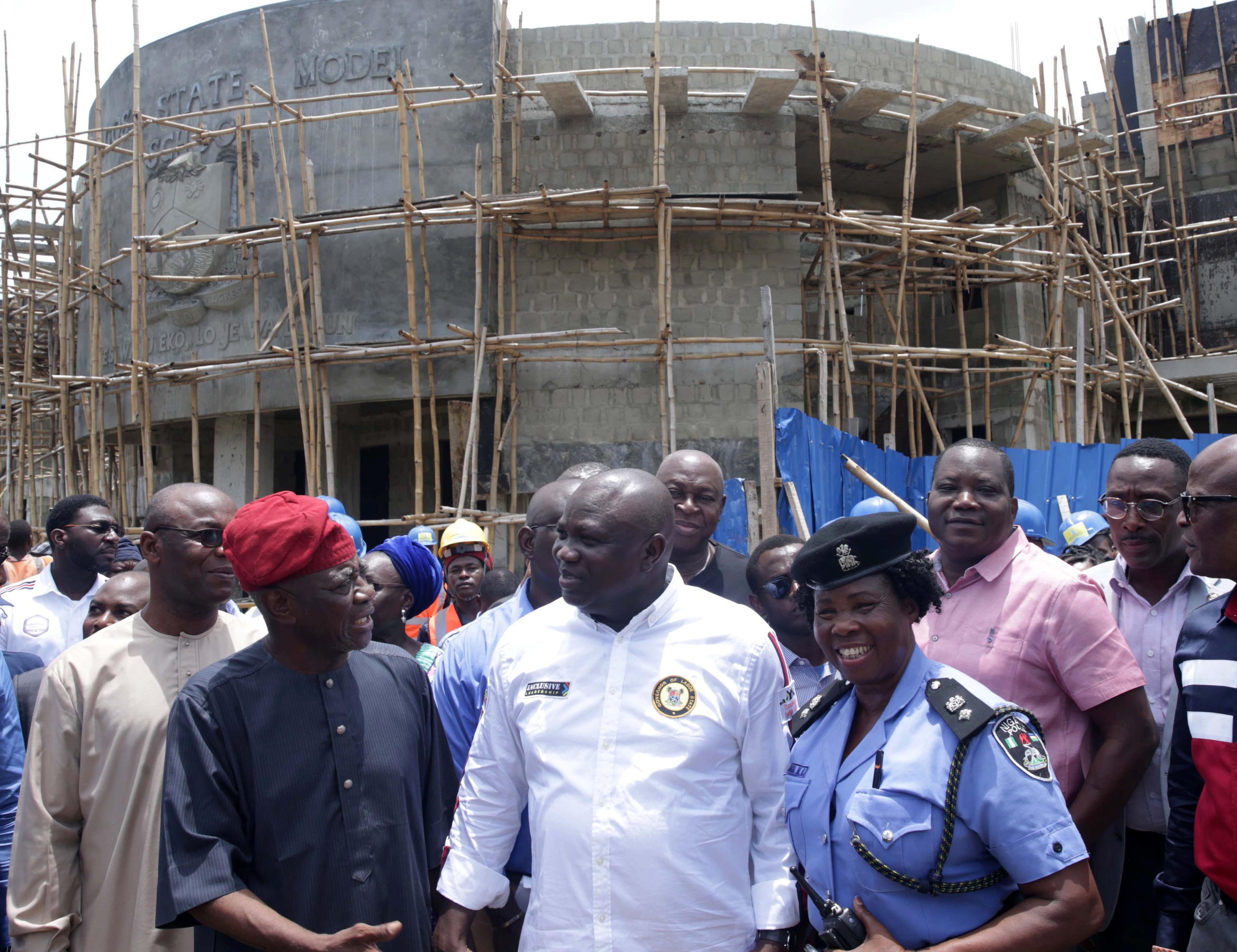 Lagos State Governor, Mr. Akinwunmi Ambode (2nd right), being welcomed by father of Vice-President's wife, Elder Olutayo Soyode (2nd left); Divisional Police Officer, Sabo Police Station, SP, Mary Ubangha (right) and others during the Governor’s inspection of the ongoing construction of Lagos State Model College, Sabo, Yaba, on Thursday, April 12, 2018.