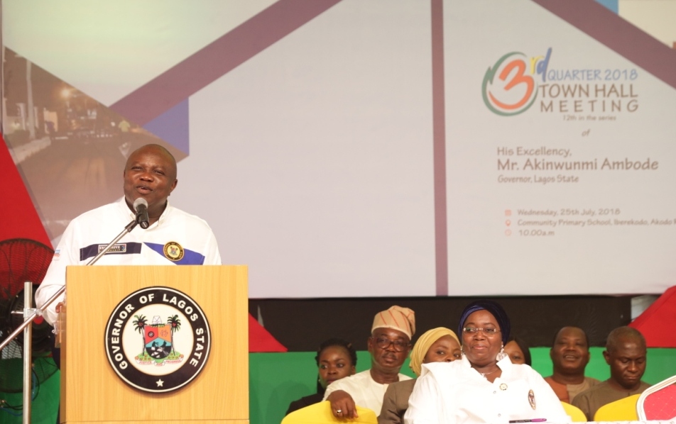 Lagos State Governor, Mr. Akinwunmi Ambode, addressing residents, traditional rulers, party chieftains and other dignitaries while Deputy Governor, Dr. (Mrs) Oluranti Adebule (right) and members of the State Executive Council watch with admiration during the 3rd Quarter 2018 Town Hall meeting (12th in the Series) at Community Primary School, Iberekodo, Ibeju-Lekki, on Wednesday, July 25, 2018.
