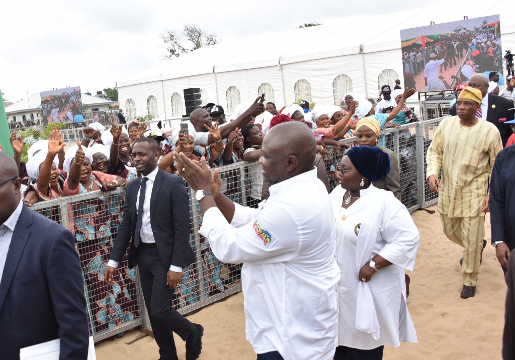Lagos State Governor, Mr. Akinwunmi Ambode (left), acknowledging cheers from residents at the 3rd Quarter 2018 Town Hall meeting (12th in the Series), held at Community Primary School, Iberekodo, Ibeju-Lekki, on Wednesday, July 25, 2018. With him is the Deputy Governor, Dr. (Mrs) Oluranti Adebule (right).