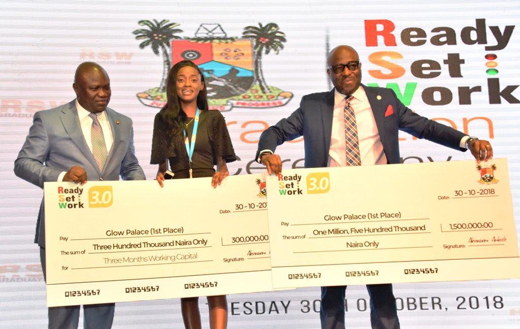 Lagos State Governor, Mr. Akinwunmi Ambode (middle); winner of the Pitch competition of Ready Set Work 3.0, Miss Vivian Afolayan (middle) and Special Adviser to the Governor on Education, Mr. Obafela Bank-Olemoh (right) during the graduation ceremony of Ready Set Work 3.0 at Landmark Event Centre, Victoria Island, on Tuesday, October 30, 2018.